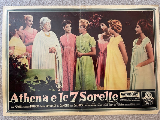 Vintage Italian movie lobby card for 'Athena e le 7 Sorelle' (Athena), featuring seven women in colorful vintage dresses against a dark outdoor background, with title text at the bottom and Metrocope/MGM logos.